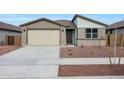 Charming single-story home featuring a two car garage and low maintenance desert landscaping at 17322 W Via Dona Rd, Surprise, AZ 85387