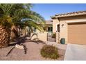 Attractive single-story home with desert landscaping and a private front entrance and spacious garage at 20623 N Enchantment Pass, Maricopa, AZ 85138