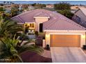 Inviting single-story home with a private courtyard, desert landscaping, and a spacious two-car garage at 20623 N Enchantment Pass, Maricopa, AZ 85138