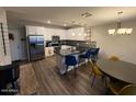 Contemporary kitchen features stainless steel appliances and an island with seating at 2821 S Skyline Dr # 134, Mesa, AZ 85212