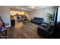 Open floor plan showing living room with hardwood floors and modern furniture at 2821 S Skyline Dr # 134, Mesa, AZ 85212
