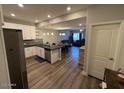 View of kitchen opening up to living and dining areas showcasing the layout at 2821 S Skyline Dr # 134, Mesa, AZ 85212
