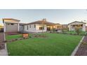 Expansive backyard featuring manicured lawn and well-maintained landscaping at 43720 N Acadia Way, New River, AZ 85087