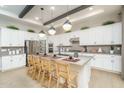 Beautiful kitchen with large island, modern lighting, and stainless steel appliances at 43720 N Acadia Way, New River, AZ 85087