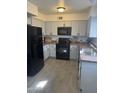 Well-maintained kitchen featuring stainless steel appliances, granite countertops, and wood-look floors at 4537 N 26Th Dr, Phoenix, AZ 85017