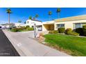 Street view of charming single story home with covered parking and mature landscaping at 7650 E Mariposa Dr, Scottsdale, AZ 85251