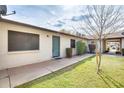 Inviting single-story home featuring desert landscaping, a walkway, and a covered parking area at 828 W Laguna Dr, Tempe, AZ 85282