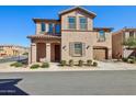 Charming two-story home featuring stucco siding, a tile roof, and a well-maintained front yard at 9923 E Texas Ave, Mesa, AZ 85212