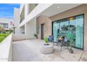 Outdoor patio with neutral decor, comfortable seating, and sliding glass door, perfect for relaxing and entertaining at 1111 E Missouri Ave # 9, Phoenix, AZ 85014