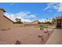 Expansive backyard featuring desert landscaping, multiple seating areas, and an artifical grass area at 1365 N El Dorado Dr, Chandler, AZ 85224