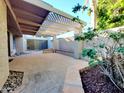 Covered back patio featuring brick pavers and a trellis cover at 1606 E Cactus Wren Dr, Phoenix, AZ 85020
