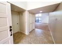 Bright foyer with tile flooring and a view into the spacious living area at 1606 E Cactus Wren Dr, Phoenix, AZ 85020