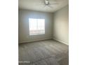Bedroom with gray walls, soft carpet, and natural light from a window at 1920 E Bell Rd # 1188, Phoenix, AZ 85022