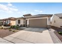 Charming single-story home featuring desert landscaping and a convenient two-car garage at 26947 W Adam Ave, Buckeye, AZ 85396