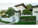 Exterior showcasing lush landscaping and a traditional Mediterranean architectural style at 3140 E Claremont Ave, Phoenix, AZ 85016