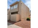 Condo with a stucco exterior, a small patio, and desert landscaping at 3526 W Dunlap Ave # 161, Phoenix, AZ 85051