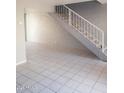Inviting living room featuring neutral colors, tile flooring, and staircase at 3526 W Dunlap Ave # 161, Phoenix, AZ 85051