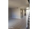 Spacious living room featuring neutral colors and tile flooring, offering a bright and airy ambiance at 3526 W Dunlap Ave # 161, Phoenix, AZ 85051