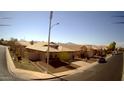 Charming single-story home with desert landscaping, tile roof, and two-car garage in a neighborhood setting at 4405 W Park St, Laveen, AZ 85339