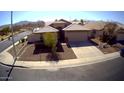 Single-Gathering home with a well-kept lawn and a two-car garage in a suburban neighborhood at 4405 W Park St, Laveen, AZ 85339