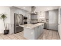 Modern kitchen with stainless steel appliances, granite countertops, and ample cabinet space at 7923 E Palm Ln, Scottsdale, AZ 85257