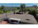 Scenic aerial view of a well-maintained home with a desert landscape and mountain views in the background at 9059 N Arroya Grande Dr, Phoenix, AZ 85028