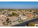 A high-angle aerial view of neighborhood houses showing mountain views in the background at 9654 E Pantera Ave, Mesa, AZ 85212