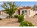 Well-kept single-story home with desert landscaping and a cozy front porch at 10960 E Monte Ave # 199, Mesa, AZ 85209