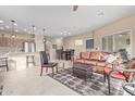 Open-concept living room with tile flooring, ceiling fan, and dining area at 10960 E Monte Ave # 199, Mesa, AZ 85209