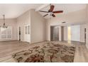 Spacious living room features vaulted ceilings, wood floors, and abundant natural light at 1500 N Markdale -- # 8, Mesa, AZ 85201