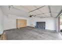 Spacious garage interior with ample storage cabinets and clean concrete flooring at 15221 N Clubgate Dr # 2094, Scottsdale, AZ 85254