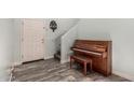 Inviting entryway showcasing stylish tiled flooring and a classic piano at 25420 W Park Ave, Buckeye, AZ 85326