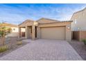 Charming single-story home featuring a neutral color palette, a two-car garage, and a well-manicured front yard at 3653 E Sweetclover Ln, San Tan Valley, AZ 85140