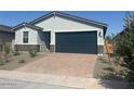 Charming single-story home with a two-car garage and desert landscaping in front at 3732 S 87Th Dr, Tolleson, AZ 85353