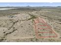 Aerial view of a vast land parcel with outlined property lines, offering potential development opportunities at 385 W Vineyard Rd, Tonopah, AZ 85354