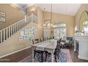 Spacious dining room featuring high ceilings, stairs, and a stylish chandelier at 4514 E Coyote Wash Dr, Cave Creek, AZ 85331