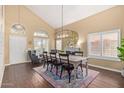 Elegant dining room with high ceilings, a fireplace, and large windows at 4514 E Coyote Wash Dr, Cave Creek, AZ 85331
