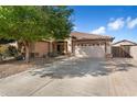 Charming single-story home featuring a well-manicured yard and a spacious two-car garage at 5932 W Poinsettia Dr, Glendale, AZ 85304