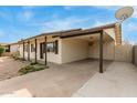 Single-story home featuring a convenient attached carport at 6031 W Hearn Rd, Glendale, AZ 85306