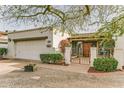 Charming single-story home with white brick, desert landscaping, and gated front entry at 1407 E Laguna Dr, Tempe, AZ 85282