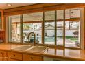 Kitchen view looks out over the backyard pool and patio area at 1407 E Laguna Dr, Tempe, AZ 85282
