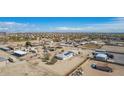 Wide aerial shot of properties in a rural neighborhood at 2038 S 221St Ave, Buckeye, AZ 85326