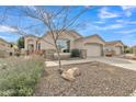 Beautiful single-story home with desert landscaping, stone accents, and a two-car garage at 2213 E Constance Way, Phoenix, AZ 85042