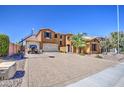 Attractive two-story home with a well-manicured yard, brick driveway and a two-car garage at 3016 N Glenview --, Mesa, AZ 85213