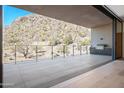 Open patio area includes BBQ with a mountain view at 5000 N Camelback Ridge Dr # 203, Scottsdale, AZ 85251