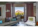 Cozy living space with access to a balcony featuring stunning views of the nearby mountain at 6850 E Main St # 4416, Scottsdale, AZ 85251