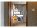 Inviting entryway featuring modern design with an open staircase and a glimpse of the stylish kitchen beyond at 6850 E Main St # 4416, Scottsdale, AZ 85251