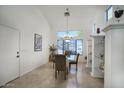 Dining room with large window and modern chandelier lighting at 7511 E Desert Vista Rd, Scottsdale, AZ 85255
