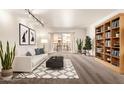 Bright living room with a couch, decorations, and a bookshelf at 7920 E Camelback Rd # 408, Scottsdale, AZ 85251
