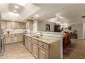 Open kitchen with granite countertops, stainless steel appliances, and a tile backsplash at 8082 E Via Del Vencino --, Scottsdale, AZ 85258